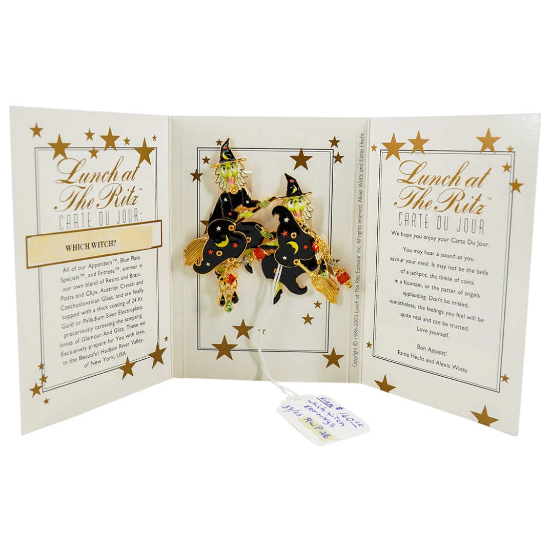 Signed "Which Witch?" Lunch At The Ritz Embellished Earrings: DESCRIPTION: A Pair of Signed "Lunch at the Ritz" vintage crystal, enamel, and rhinestone earrings, in gold plate. Depicts a pair go witches flying on a broom. Signed "Lunch at the Ritz". Model: "Whic