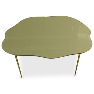 Robsjohn Gibbons Style Mid Century Table: DESCRIPTION: Robsjohn Gibbons Style Mid Century table comprised of a brass foundation with smokey glass top. CIRCA: Mid-Late 20th Cent. ORIGIN: USA DIMENSIONS: H: 18.5" W: 41" L: 46.5" CONDITION: Grea