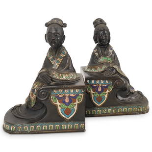 Antique Japanese Figural Enamel Bronze Bookends: DESCRIPTION: Antique Japanese bronze bookends depicting a wiseman and Geisha with intricate flowing robe details and inlaid polychrome enamels. CIRCA: 20th Cent. ORIGIN: Japan DIMENSIONS: H: 8" x W: 3