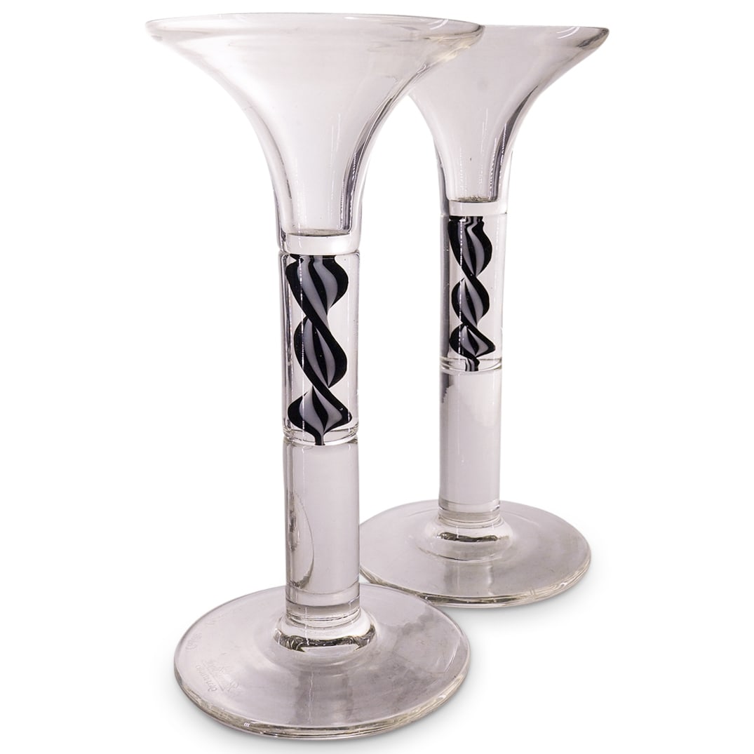 Pair of Rosenthal Studio Glass Candlesticks Claus Schwanewilms: DESCRIPTION: Pair of Rosenthal Studio glass candlesticks by Claus Schwanewilms featuring clear tapered forms with black and white swirl inner decoration. Marked: 'Rosenthal Glass-Studio, Claus Schwane