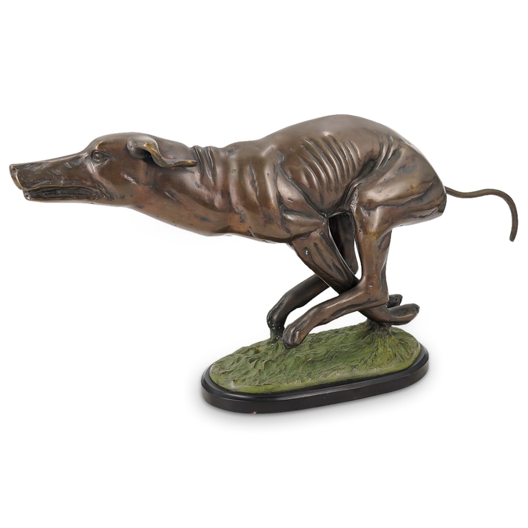 Bronze Running Hound Dog Statue: DESCRIPTION: A bronze statue depicting a naturalistic cast dog in a running pose, mounted on a green patinated grassy textured base with ebonized wood plinth. CIRCA: 20th Cent. ORIGIN: Continental DIM