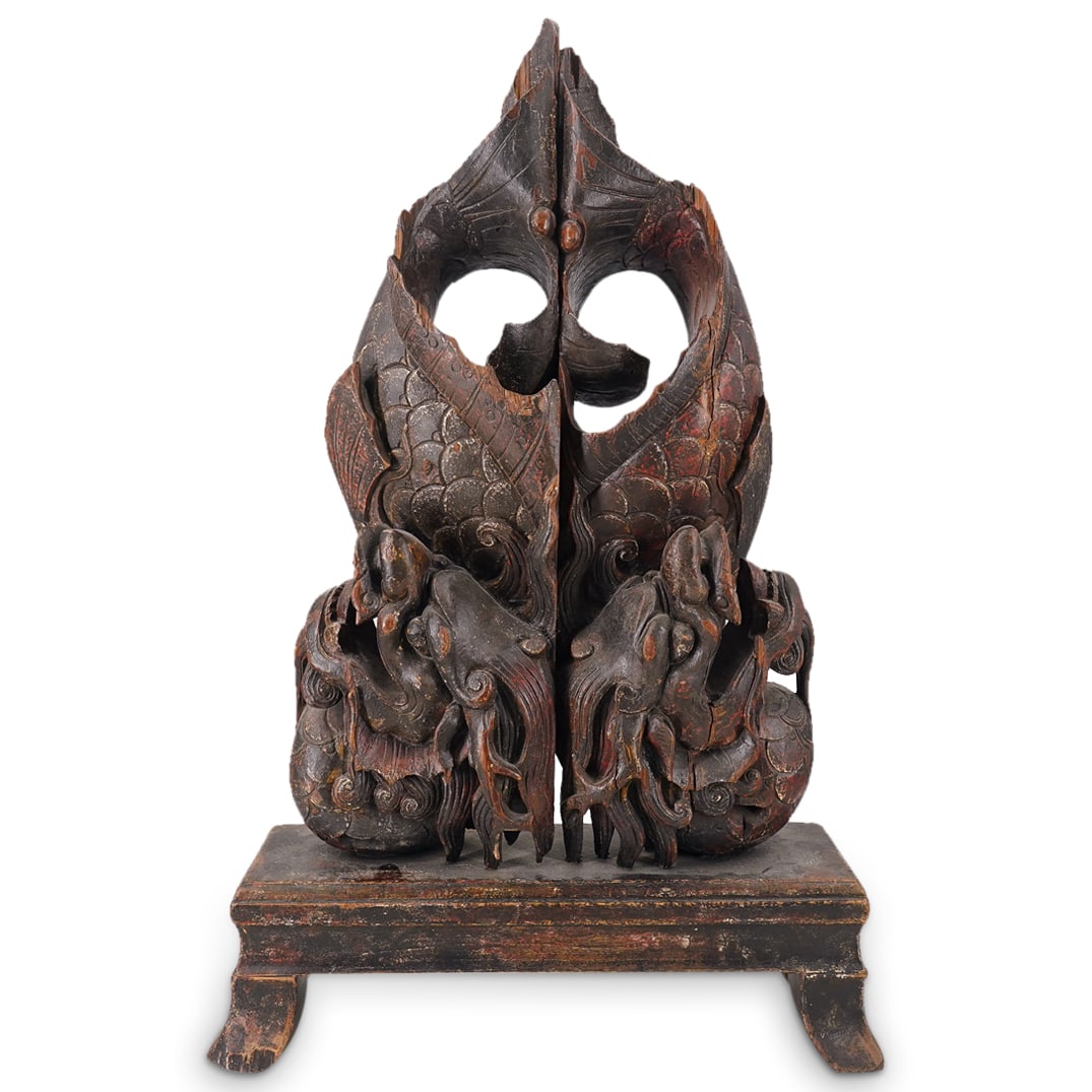 Antique Chinese Carved Wood Dragon Sculpture: DESCRIPTION: An antique Chinese carved sculpture depicts twin dragons mirroring each other, mounted atop a platform base. CIRCA: Early 20th Cent. ORIGIN: China DIMENSIONS: H: 30.5" W: 19" CONDITION: M