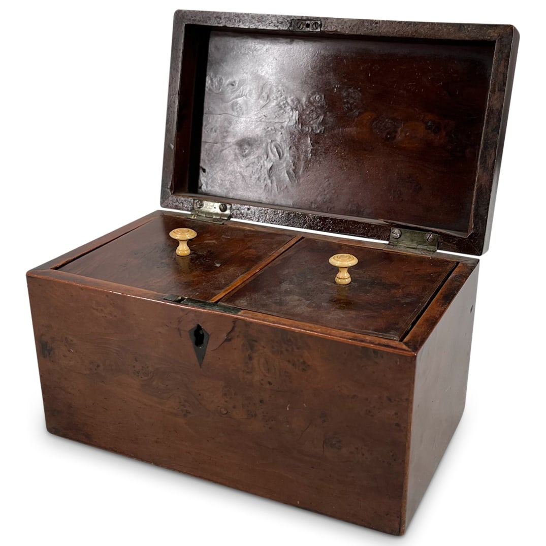 Antique English Tea Caddy: DESCRIPTION: Antique English tea caddy with two compartments and a hinged lid, each compartment with its own lid with a carved bone handle. CIRCA: 19th century. ORIGIN: England DIMENSIONS: H: 4.75" W 