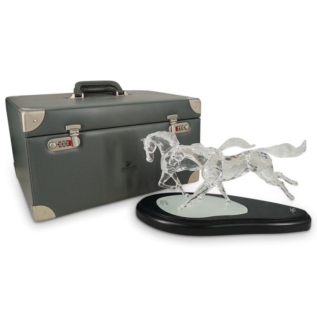 Limited Edition Swarovski "Wild Horses" Crystal Figurine Sculpture: DESCRIPTION: Limited Edition Swarovski "Wild Horses" Crystal Figurine Sculpture. Features a pair of wild horses caught in mid-stride. This is a limited edition sculpture figurine, numbered 2,869 of 10