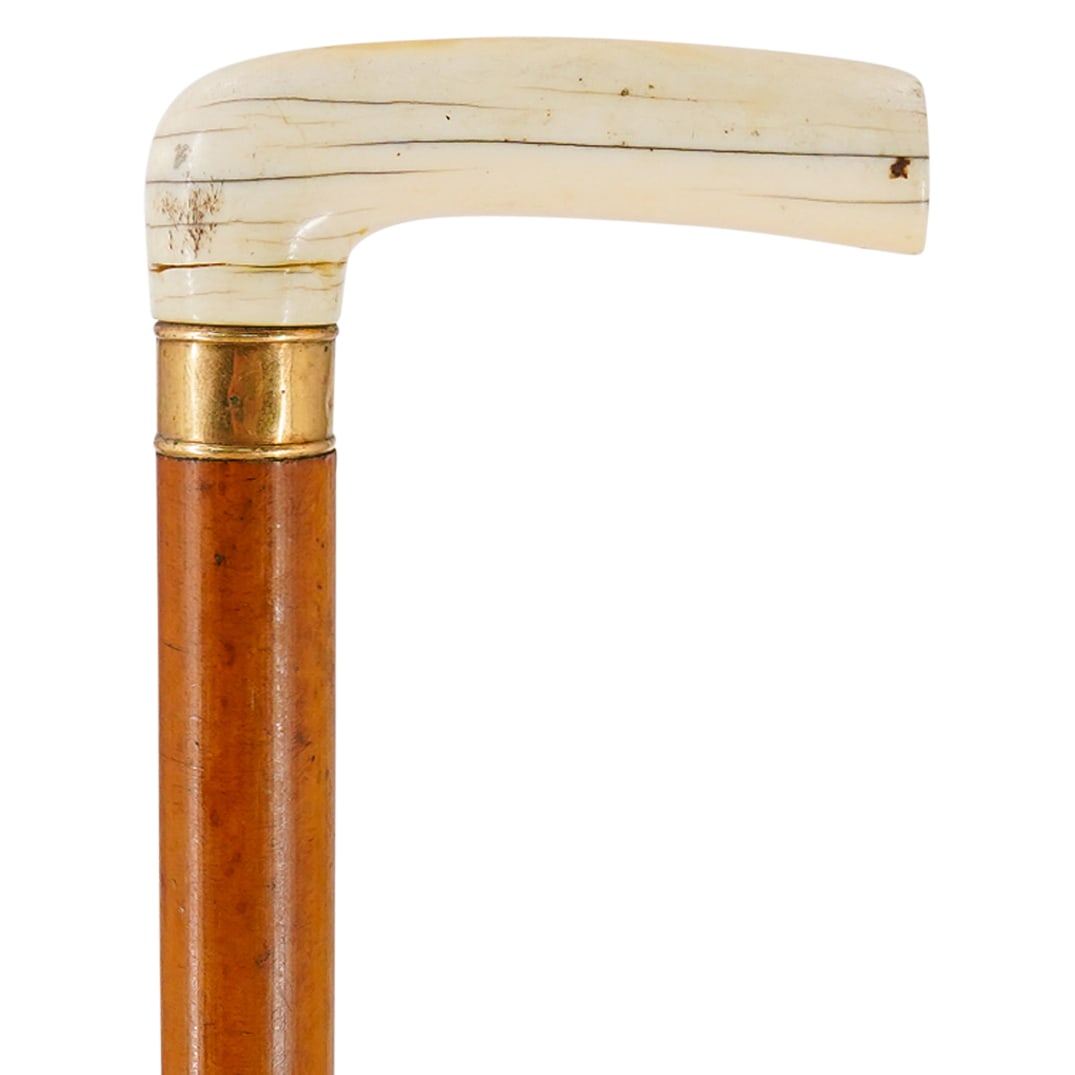 Antique 14K Gold And Carved Bone Handled Cane: DESCRIPTION: Antique walking cane featuring a carved bone handle fitted above a 14K gold collar. CIRCA: 19th to early 20th Century ORIGIN: European DIMENSIONS: H: 34.75" W: 0.75" L: 2.75" CONDITION: H