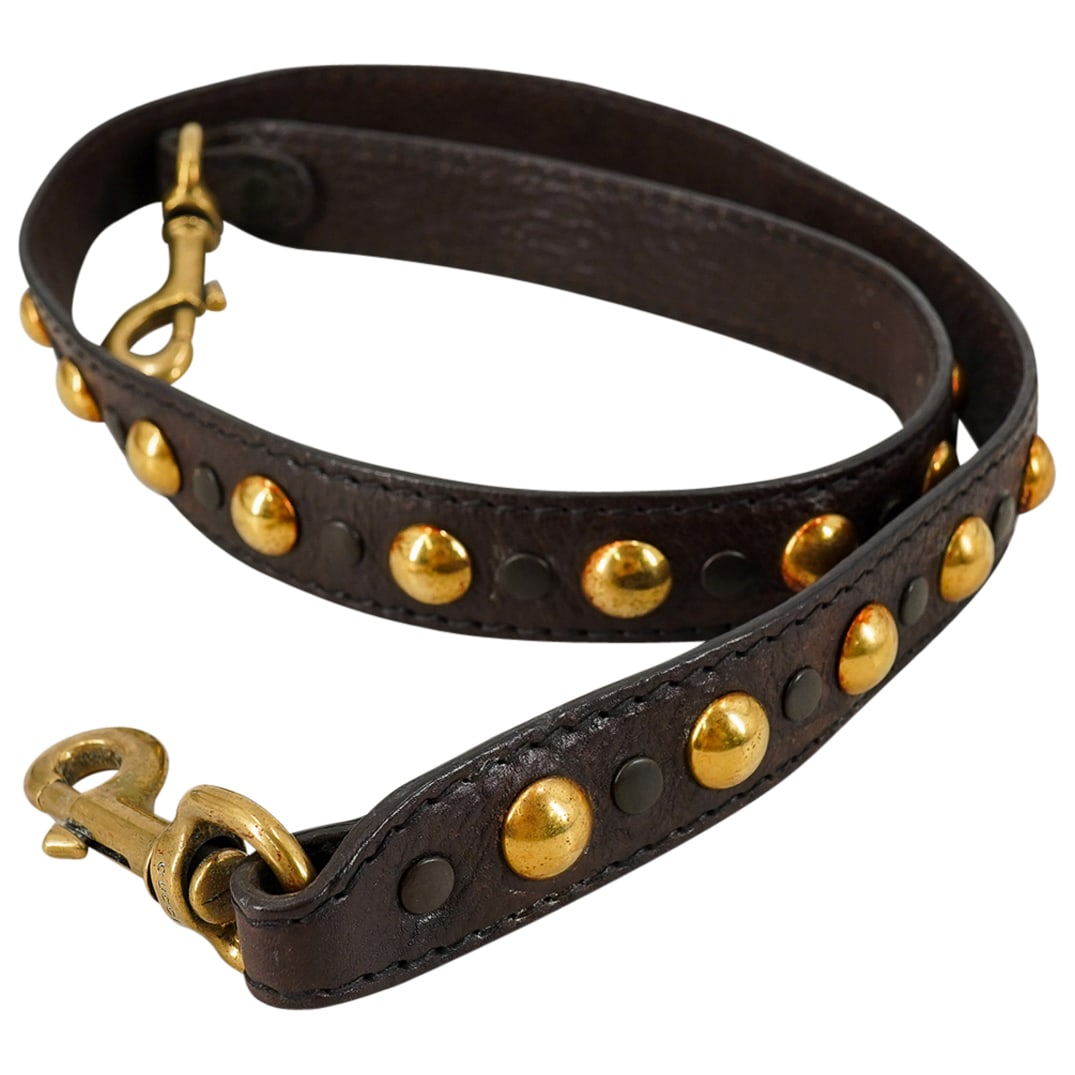 Vintage Gucci Leather & Brass Shoulder Strap: DESCRIPTION: Vintage Gucci leather and brass shoulder crossbody strap, designed with brown leather and brass studs and hardware. CIRCA: 20th Century ORIGIN: Italy DIMENSIONS: L: 43" CONDITION: Pre-own