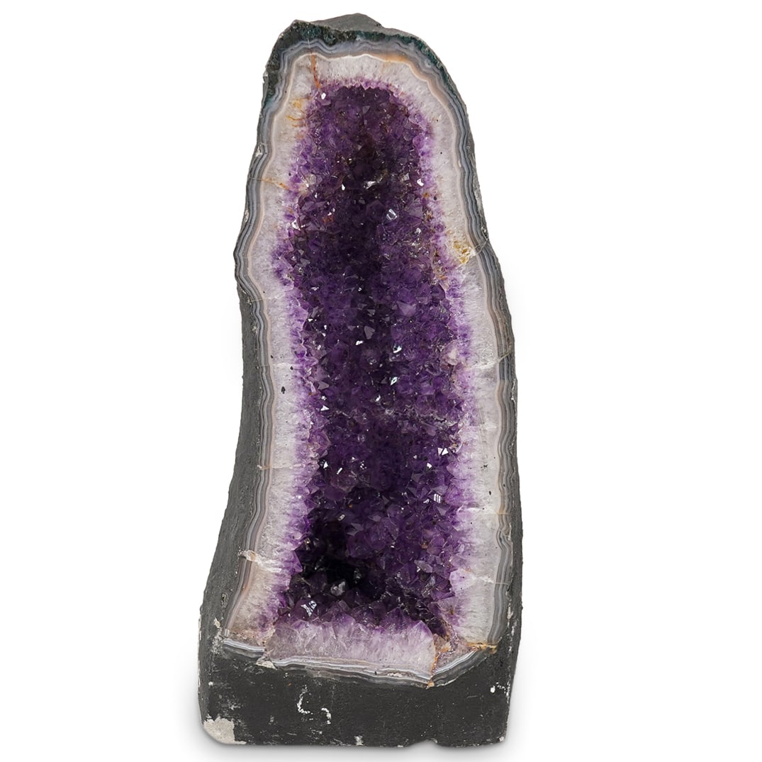 Amethyst Crystal Cathedral: DESCRIPTION: An amethyst crystal cathedral featuring polished border and comprised of amethyst crystals set into painted concrete. CIRCA: Early 21st century ORIGIN: Probably Brazilian DIMENSIONS: H: 1