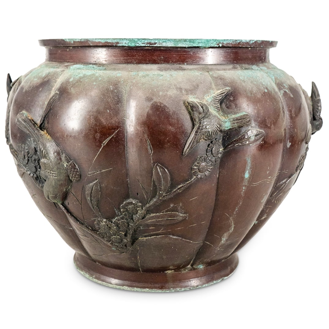 Japanese Meiji Bronze Pheasant Planter: DESCRIPTION: Bronze planter featuring pheasant, songbird, and (possibly) Fenghuang (Chinese phoenix) designs in high relief on and around a blossoming branch in low relief near etched water and foliag