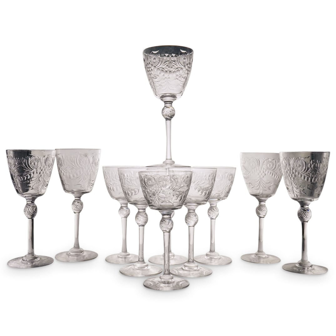 (11 Pc) Hawkes Style Cut Crystal Glass Stemware: DESCRIPTION: Set of 11 glasses cut in the style of Hawkes with floral, foliage, and geometric patterns on the bowls, a six-pointed star pattern on the feet, and a swirl-ribbed orb on the stem. Dimensi