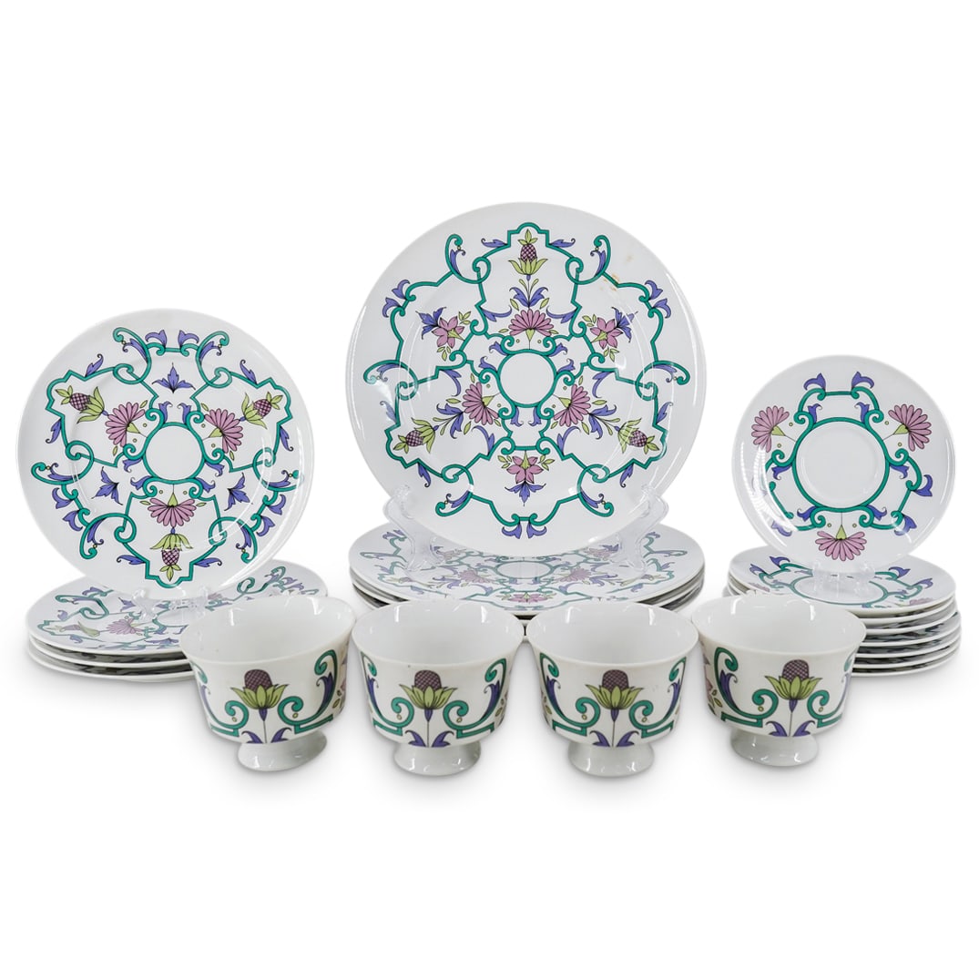 (20 Pc) Royal Tettau "Kismet" Patterned Porcelain Service: DESCRIPTION: 20 piece set porcelain service by Royal Tettau crafted in the Kismet pattern, each piece of which features floral, foliage, and pineapple motifs. Dimensions and piece count are as follows