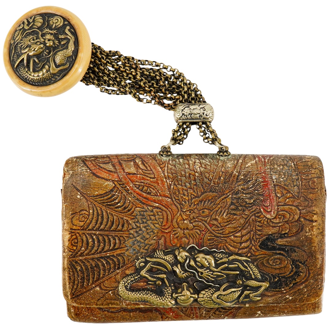 Antique Japanese Leather Dragon Wallet: DESCRIPTION: Antique leather four pocket wallet featuring a polychrome dragon crafted throughout its exterior and sporting a delicately crafted metal dragon on its front. Finished with a multi-chain f