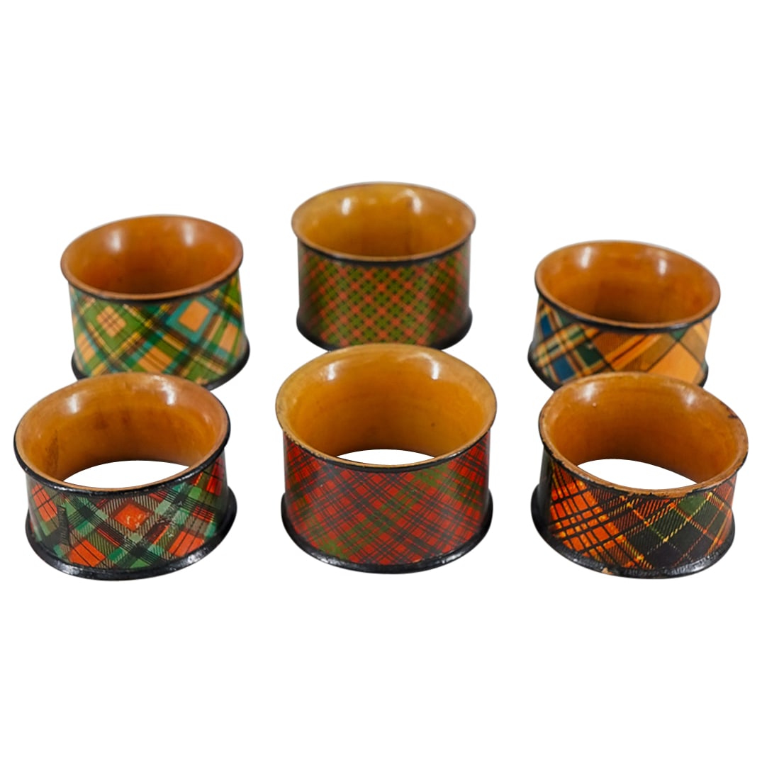 (6 Pc) Wooden Tartan Napkin Rings: DESCRIPTION: Six wooden napkin rings, each decorated with a tartan pattern, some marked with a clan name. CIRCA: 20th - early 21st century ORIGIN: Unknown DIMENSIONS: W: 1.25" Diameter: 2" CONDITION: 