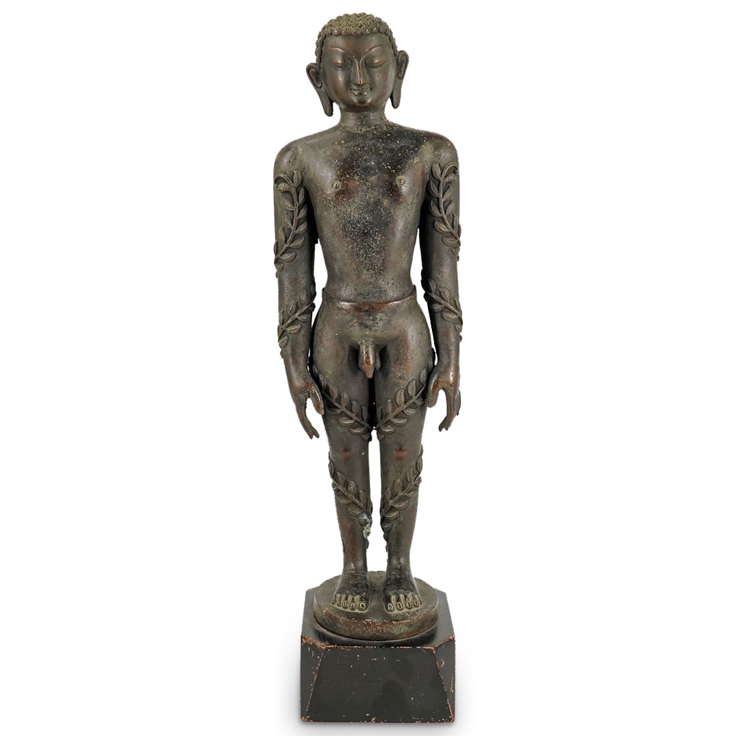 Antique Indo Nepalese Bahubali Bronze: DESCRIPTION: Antique bronze nude figurine of Bahubali, a Jainist hero, featuring vines growing up his limbs. Figure is intricately fashioned, sporting highly detailed hair and appendages, almond eyes,