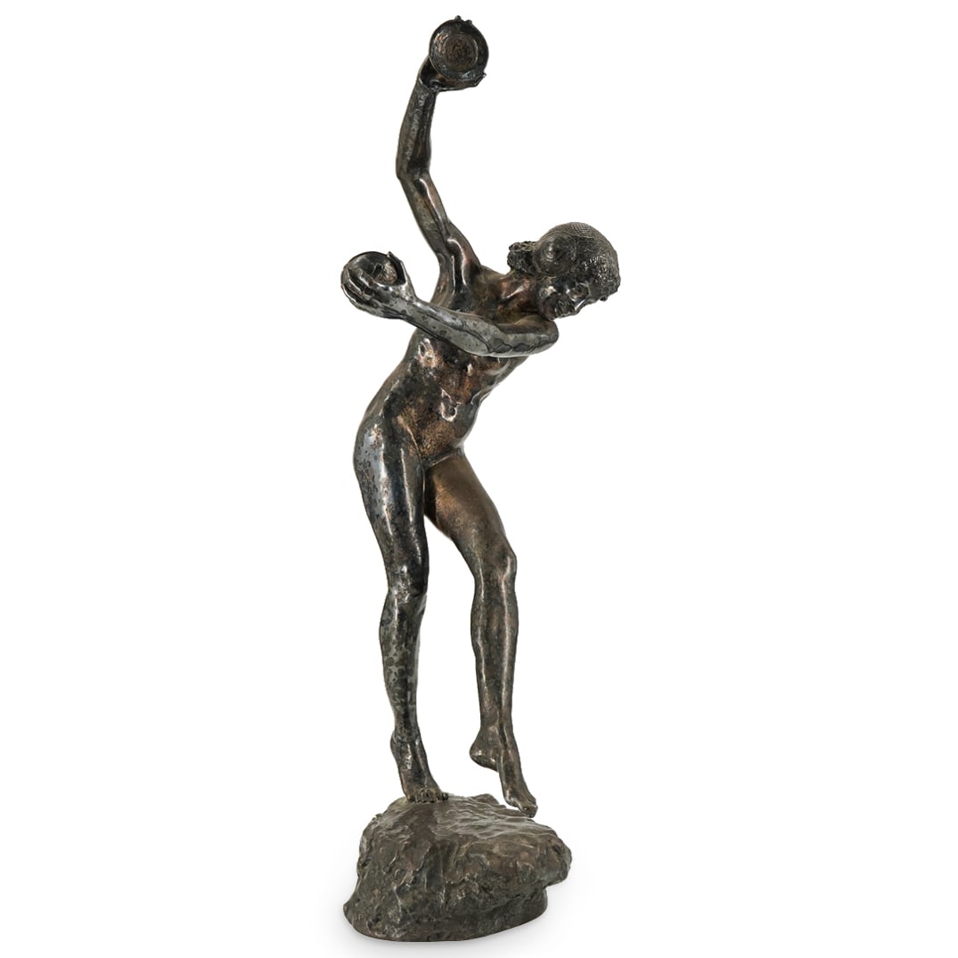 Lawrence Dupuy (France) "Cymbals" Silvered Bronze: DESCRIPTION: A bronze by Lawrence Dupuy titled "Cymbals" depicts a nude Art Nouveau dancer with cymbals in each hand, standing atop a rock formation base, completed with a silvered patina finish. Sign