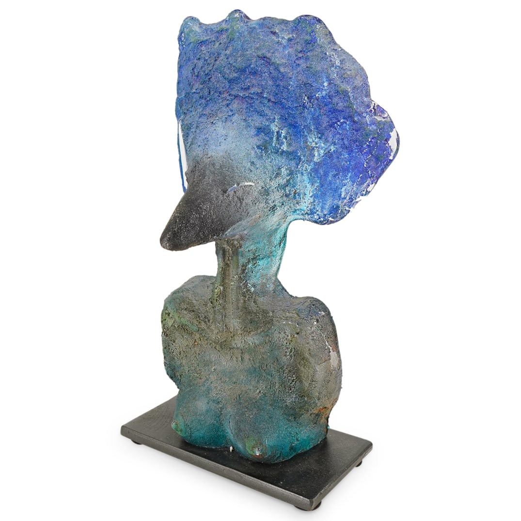 Bjorn Ekegren (Sweden B. 1955) "Eagle" Art Glass Sculpture: DESCRIPTION: Art glass sculpture by Bjorn Ekegren depicting a double sided surrealist nude bust crafted with a mix of sand in blue, turquoise, and green. Signed along the back "Bjorn Ekegren". Mounted