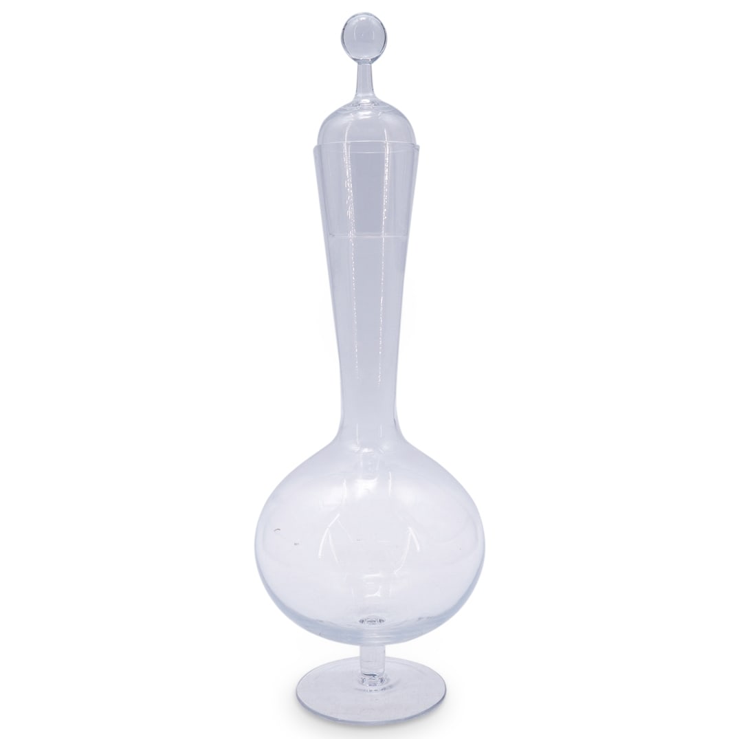 Oswald Haerdtl (1899-1959) for Lobmeyr Glass Ambassador Decanter: DESCRIPTION: Oswald Haerdtl (1899-1959) for Lobmeyr Glass Ambassador Decanter features in a clear foundation with a bulbous form with graduated neck, completed with a stopper acting as a single cup. C