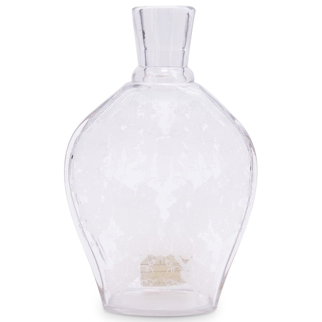 Baccarat Grapevine Crystal Glass Decanter: DESCRIPTION: Baccarat decanter crafted from crystal and featuring frosted grapevine motifs on either of its broad side. Hallmarked on underside. CIRCA: 20th Century ORIGIN: France DIMENSIONS: H: 8.75"