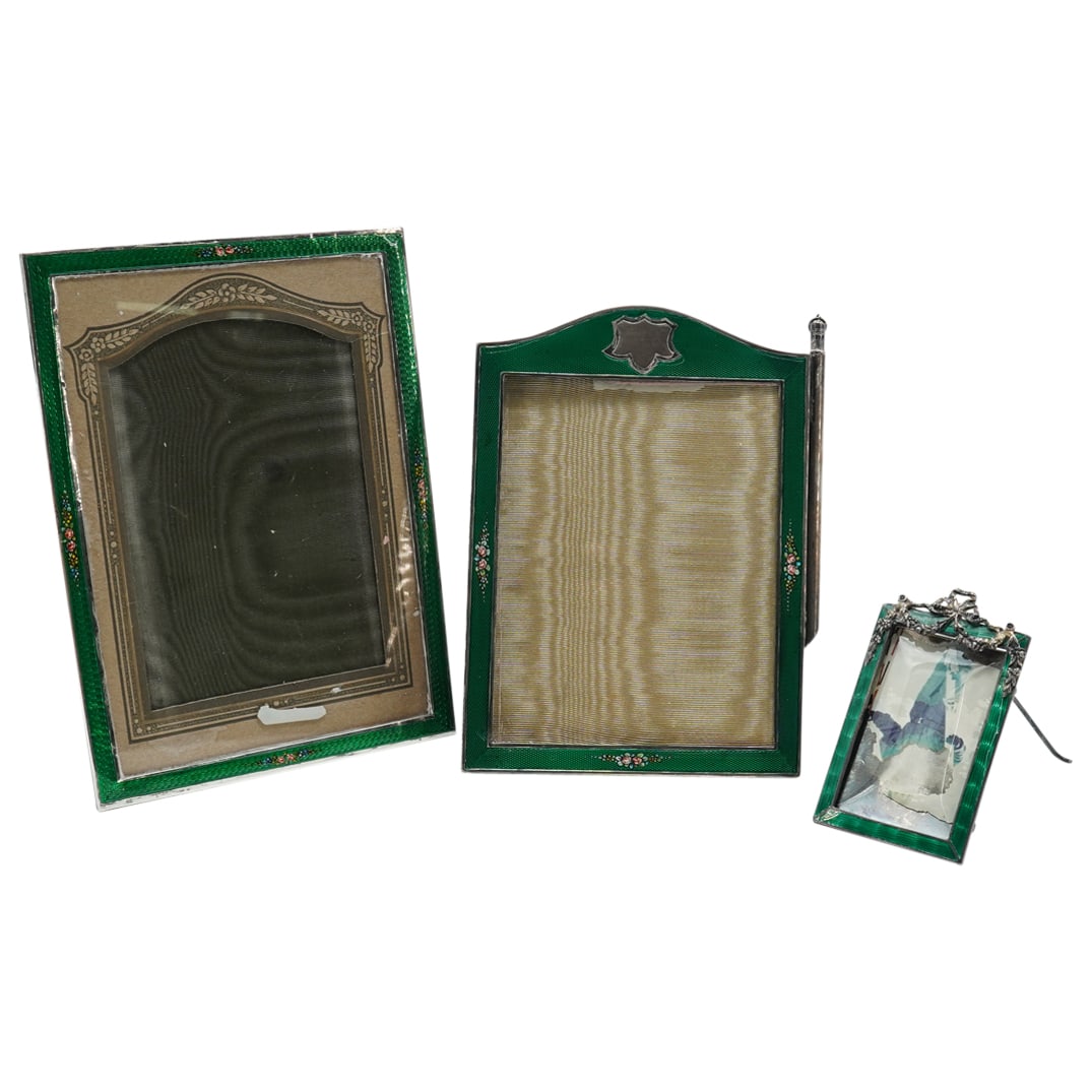 (3 Pc) Enameled Sterling Silver Picture Frames: DESCRIPTION: Three enameled sterling silver photo frames, each featuring green-hued enamel: (1) English wood & enameled sterling silver picture frame, sponsor's mark obscured, Birmingham, 1927, featur