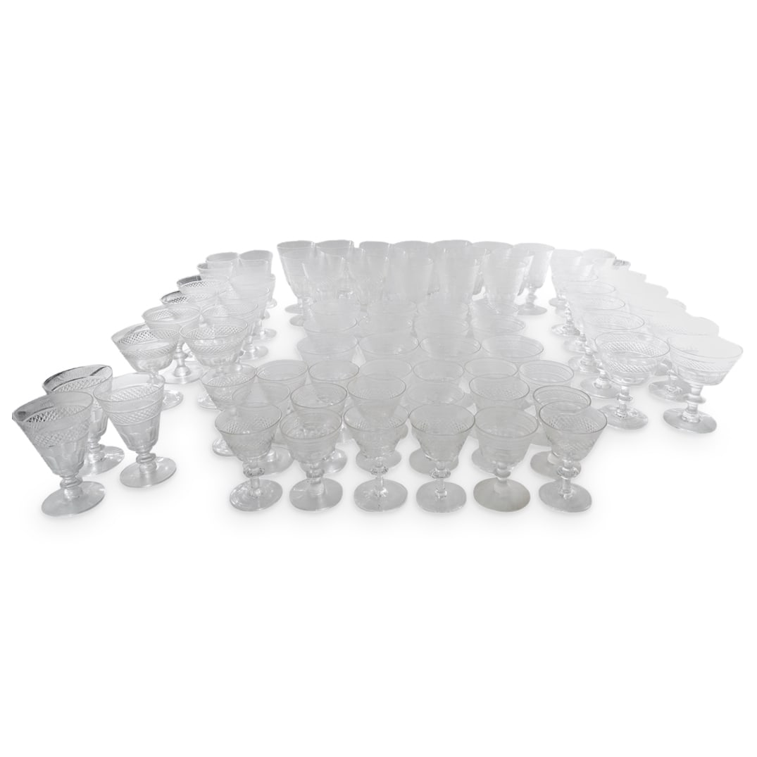 (78 Pc) Crosshatched And Faceted Glass Stemware: DESCRIPTION: 79 pieces of glass stemware, each featuring a faceted and crosshatched bowl and a disc form knob at the center of its stem. Dimensions and piece count are as follows: (18) Water goblets -