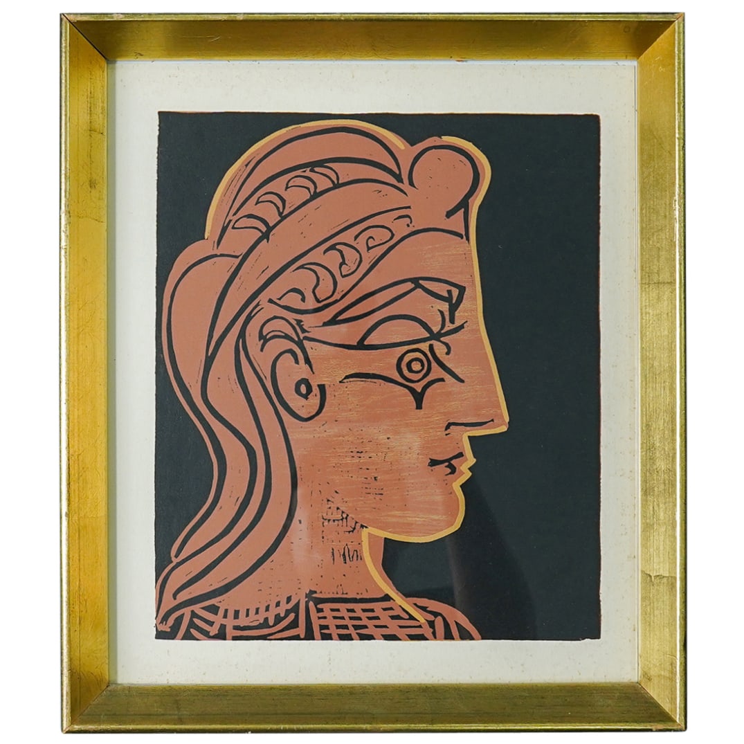 Picasso (Spanish, 1881) "Tete De Femme" Linocut: DESCRIPTION: Picasso (Spanish, 1881) "Tete De Femme" Linocut depicts the profile on a woman. Completed in a gilt wood frame. CIRCA: 1960s ORIGIN: Spain DIMENSIONS: H: 14" W: 12" | Image: 10.5" x 9" CO
