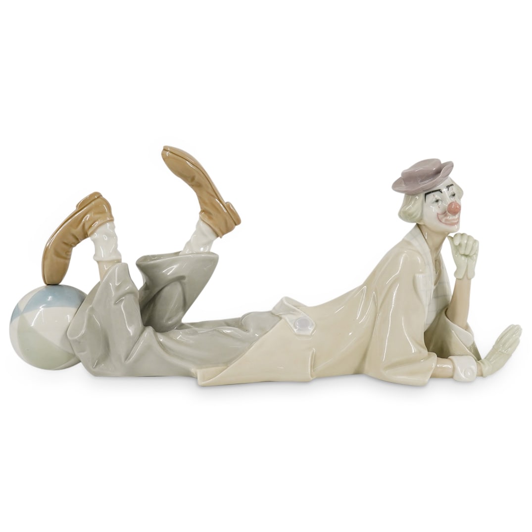 Lladro "Resting Clown" Porcelain Figurine: DESCRIPTION: Lladro porcelain figurine depicting a resting clown, with a large ball on his feet. Model number: #4618. Marked with Lladro hallmark on the underside. CIRCA: 20th Century ORIGIN: Spain DI
