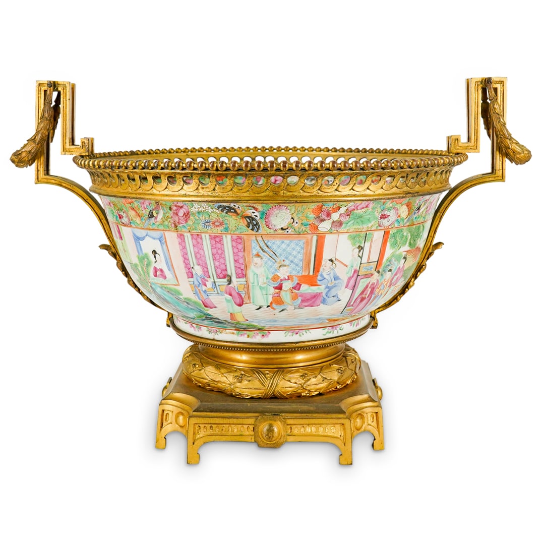 Antique Dore Mounted Chinese Rose Mandarin Porcelain Bowl: DESCRIPTION: Antique centerpiece composed of a rose Mandarin porcelain bowl fitted within a dore bronze frame composed of a fasces wrapped, eight footed base, two garland festooned handles, and a gall