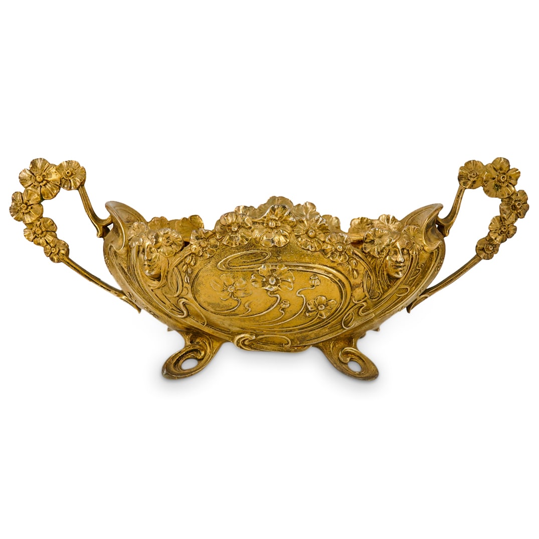 Claude Bonnefond (France, 1796-1860) Bronze Centerpiece: DESCRIPTION: bronze centerpiece by claude Bonnefond featuring flower laden handles flanking an oblong bowl on four pierced feet of organic design. Each broadside sports floral reliefs and two flower c