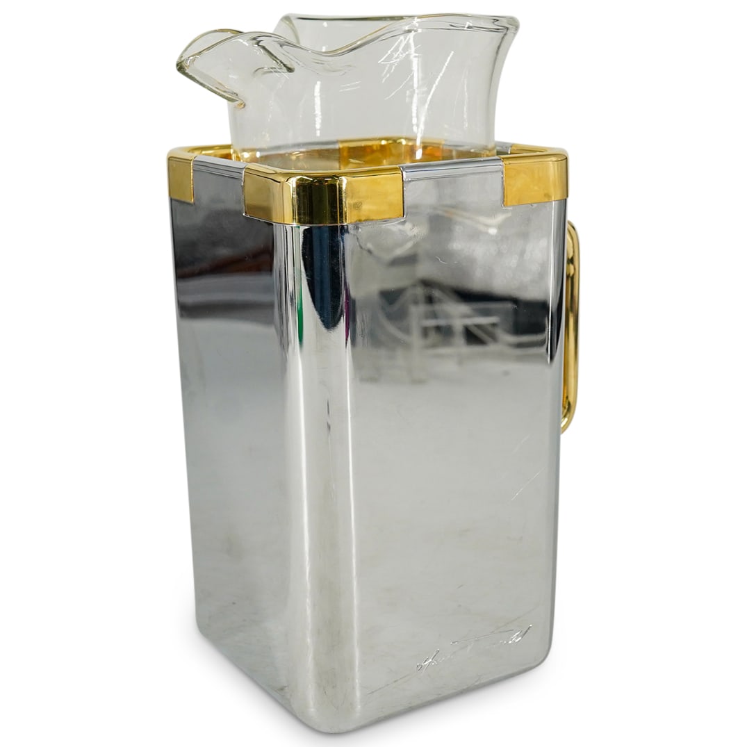 Vintage Turnwald Collection Glass And Composite Pitcher: DESCRIPTION: Vintage pitcher by Hans Turnwald from The Turnwald Collection composed of a glass pitcher proper mounted within an insulated silver and gold tone vessel marked on side with designer signa