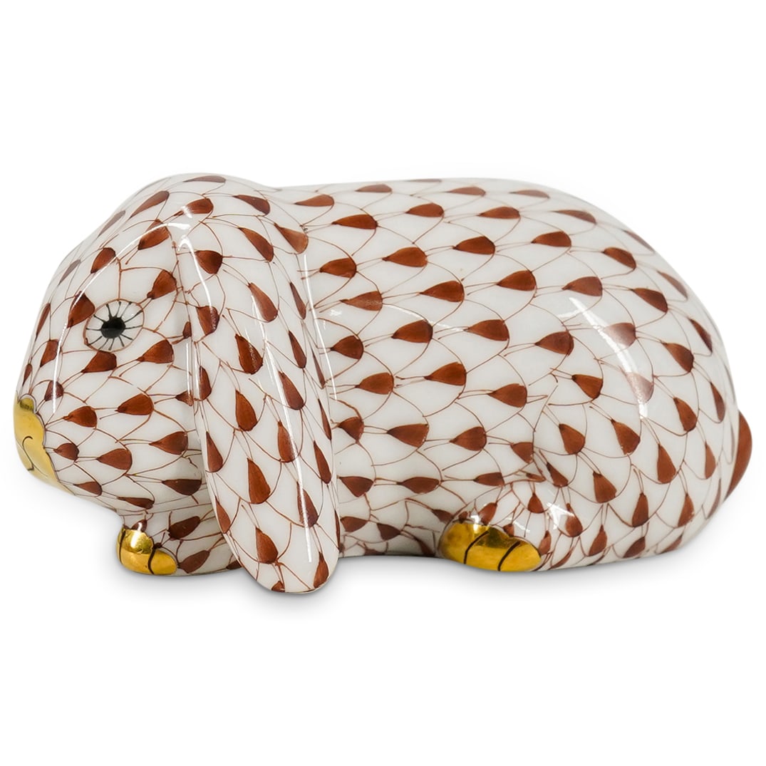 Herend Porcelain "Lop Ear Bunny" Chocolate Fishnet Figurine: DESCRIPTION: Herend porcelain figurine depicting a "Lop Ear Bunny" and featuring chocolate brown fishnet pattern and gilded accents. Style number: #15510. Marked with Herend hallmark on the underside.