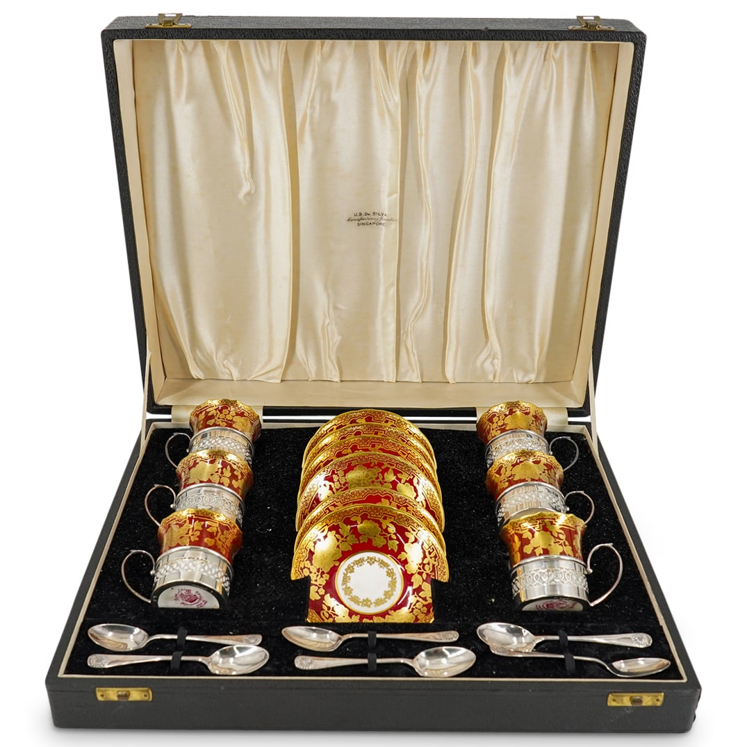 English Bone China W/ Silver Hammersley Coffee Demitasse Set: DESCRIPTION: A set of six Hammersley bone china coffee cups and saucers, with sterling silver cases, Birmingham, 1952 and six sterling teaspoons with case, Charles S. Green, Sheffield 1952. With case.