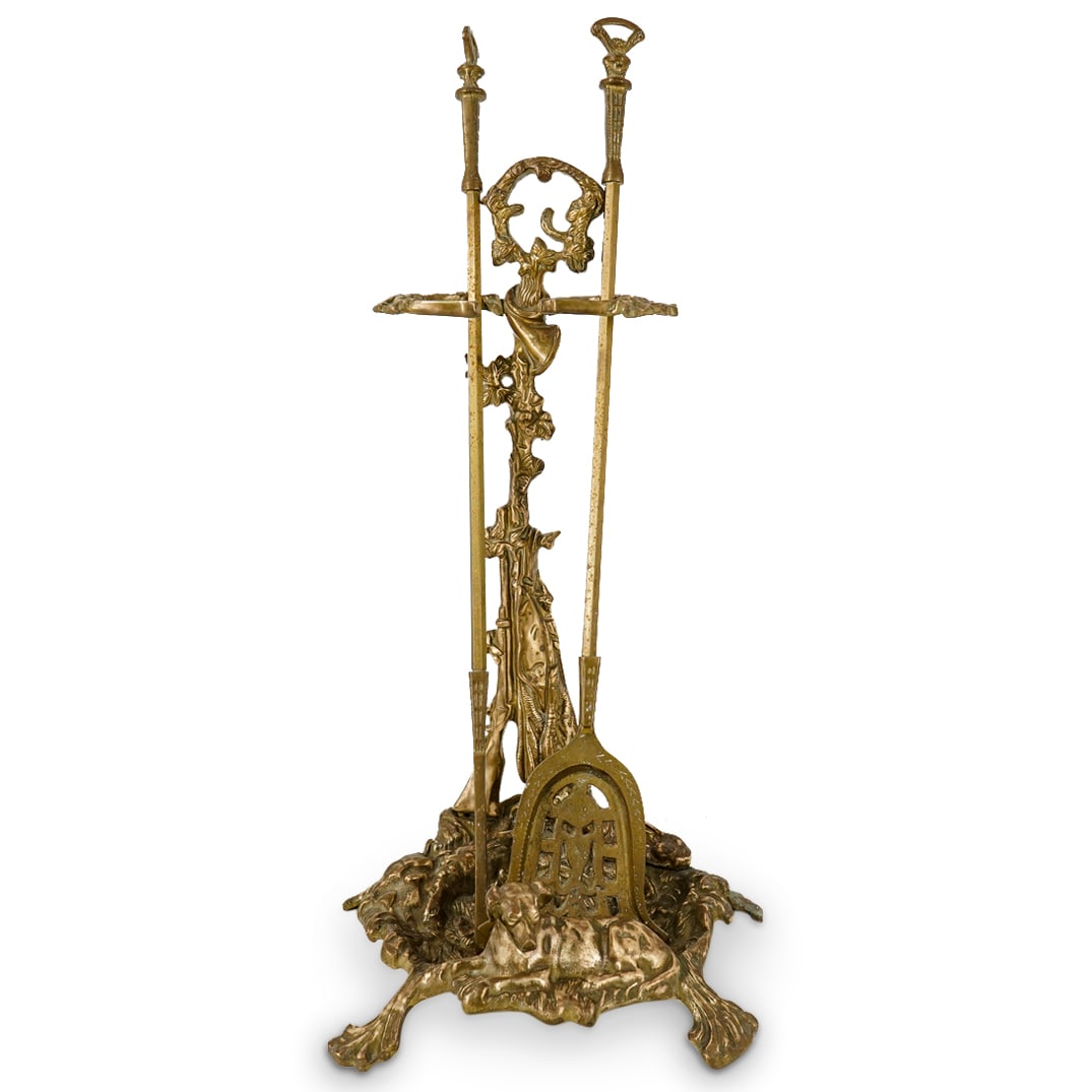 (3 Pc) Fireplace Tools & Hunting Themed Holder: DESCRIPTION: Three metal items: (1) Hunting themed fireplace tool holder, of rococo style, depicting a recumbent dog in front of a tree, the tree with a rifle leaning against it, a dead hare tied to i