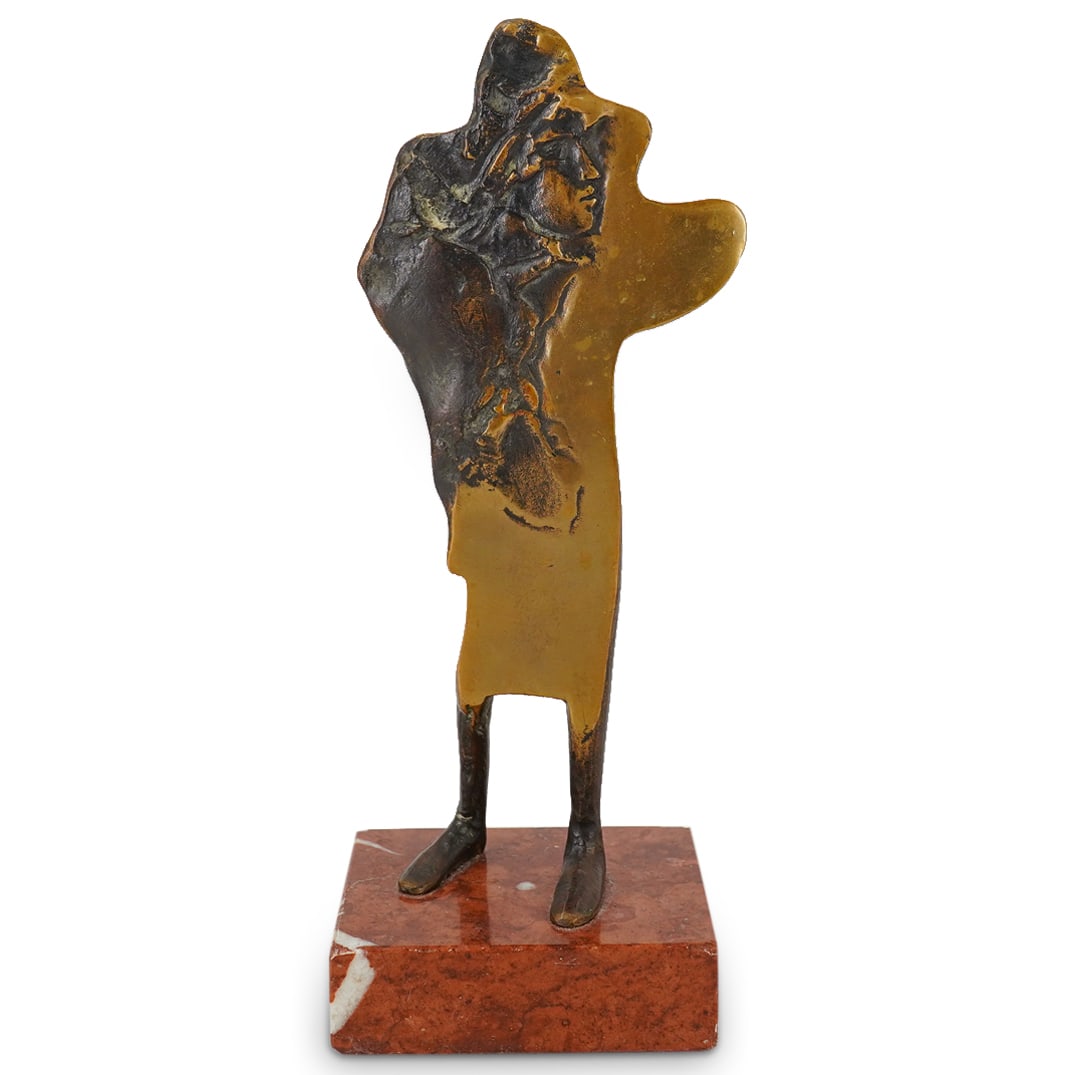 Surrealist Parcel Gilt Bronze Sculpture: DESCRIPTION: Surrealist parcel gilt bronze sculpture of a figure. Signed and dated at reverse. Possibly numbered "N/6" at reverse. Mounted atop a stone base. CIRCA: 1988 ORIGIN: Western DIMENSIONS: H: