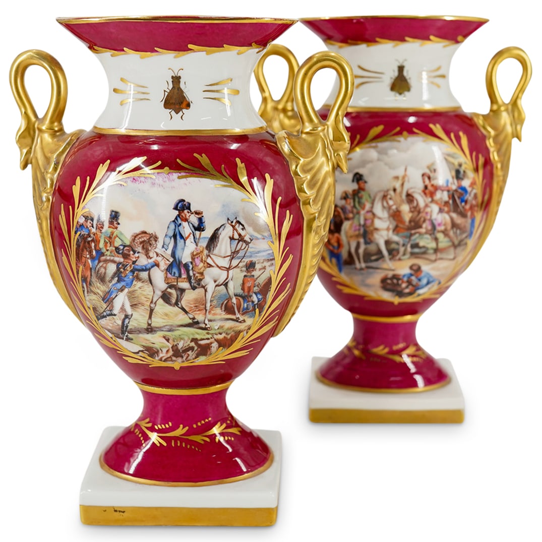 Pair Limoges Porcelain Napoleonic Vases: DESCRIPTION: Pair of Limoges porcelain vases, each with swan-form handles, one side decorated with an insect and a Napoleonic battle scene, the other decorated with an eagle, and each featuring gildin