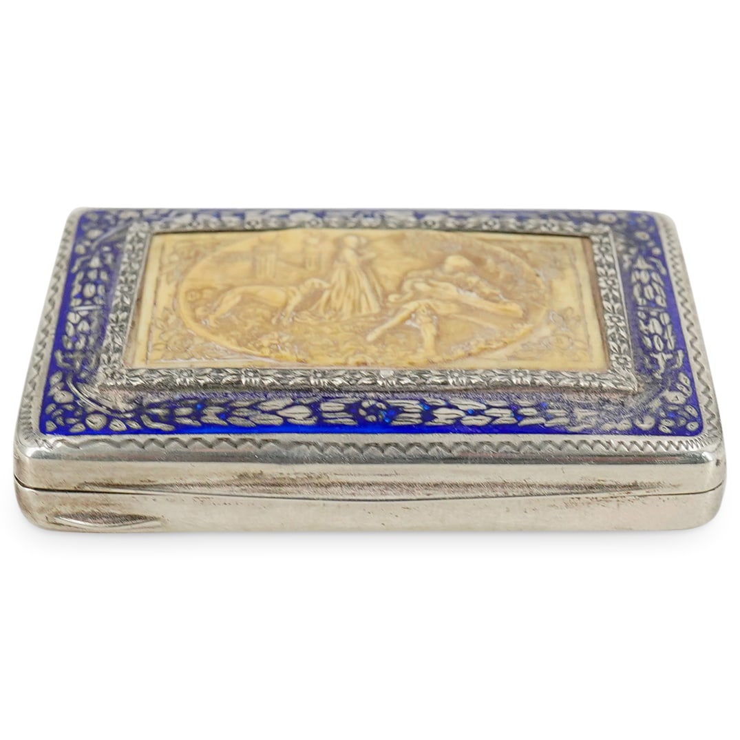 Antique 800 Silver Italian Hinged Case: DESCRIPTION: Antique 800 silver Italian hinged case with blue enameled accents and frontal central carved bone relief motif depicting an exterior scene with a pair of ladies, a dog, and a troubadour p