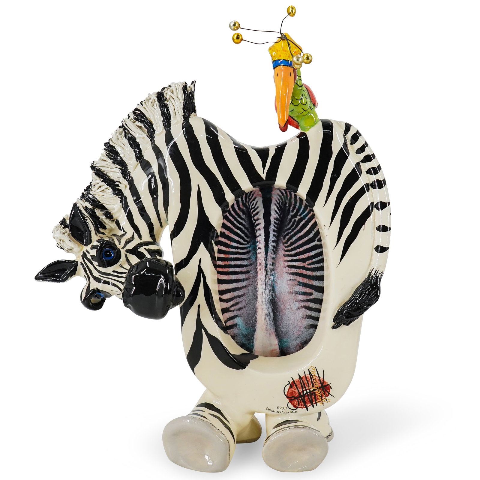Character Collectibles Zebra & Bird Picture Frame: DESCRIPTION: Character Collectible ceramic picture frame in the form of a zebra with a bird perched on its back, the bird featuring metal components at top. CIRCA: Early 21st century ORIGIN: Unknown D