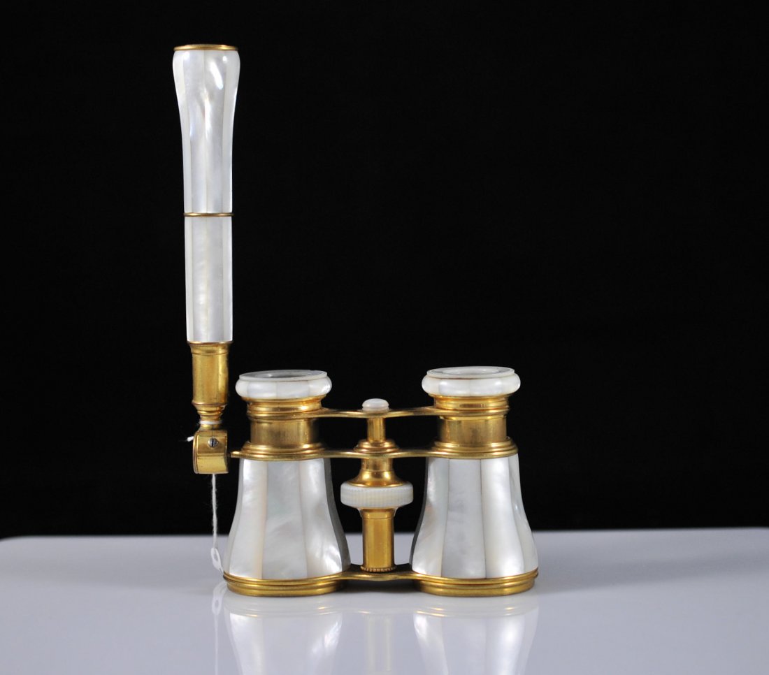 Antique Mother-of-Pearl Opera Glasses with Handle: DESCRIPTION: Antique French Mother-of-Pearl gilded gold bronze Opera Glasses with Handle. Marked Lemaire Paris. CIRCA: 1880s Origin: France DIMENSIONS : L:5" H:2.5"