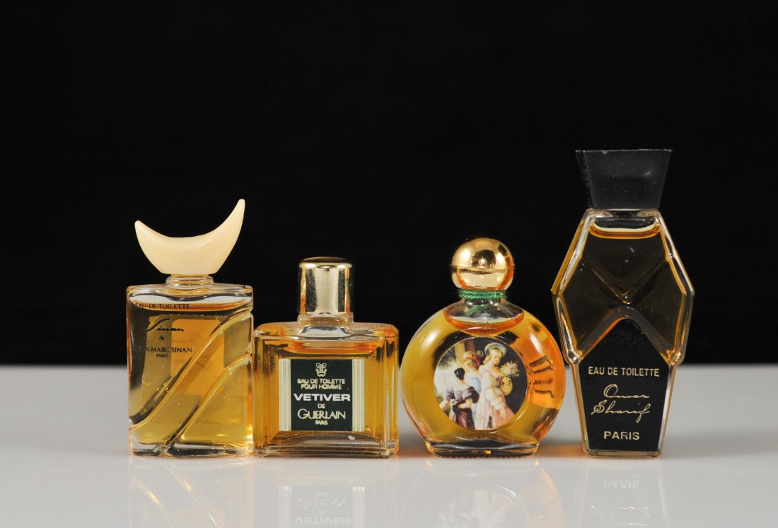 Set of four vintage miniature Parisian perfume bot: DESCRIPTION: Set of four French miniature perfume bottles. Four different brands: Omar Shariff, Jean Marc Sinan, Vetiver de Guerlain, and Jean Desprez Bal a Versailles. All bottles are full and have n