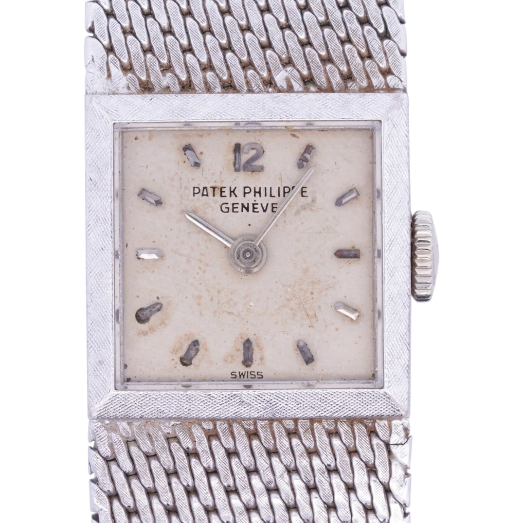Vintage Patek Philippe 18k White Gold Ladies Watch: DESCRIPTION: Vintage Patek Philippe 18k white gold ladies watch with square dial and woven bracelet, crafted with a manual wind-up movement. Interior case back marked: 'Patek Philippe & Co. Geneve Swi
