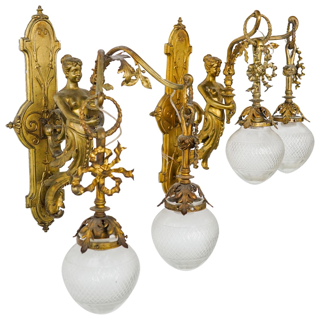 Pair Gilt Bronze & Spelter Figural Wall Sconces: DESCRIPTION: Pair of gilt bronze & spelter two-light wall sconces later fitted for electricity, each bronze backplate decorated with relief foliage motifs and supporting a central bronze component in 