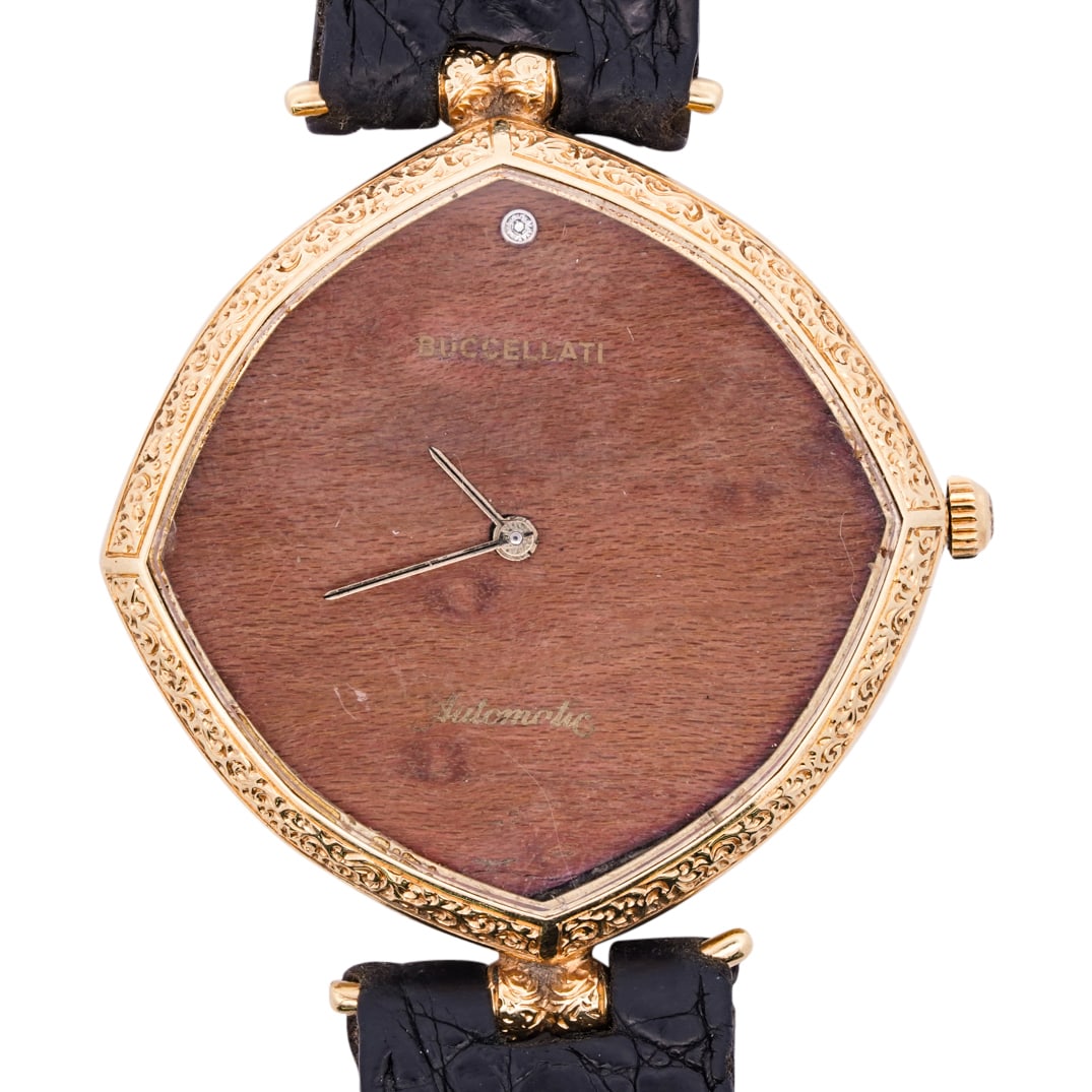 Vintage Buccellati 18k Yellow Gold Men's Watch: DESCRIPTION: Vintage Buccellati 18k yellow gold mens watch with wood grain dial and engraved bezel, completed with diamond inset crown. Quartz movement, case back with stamp engraved: 'Buccellati' com