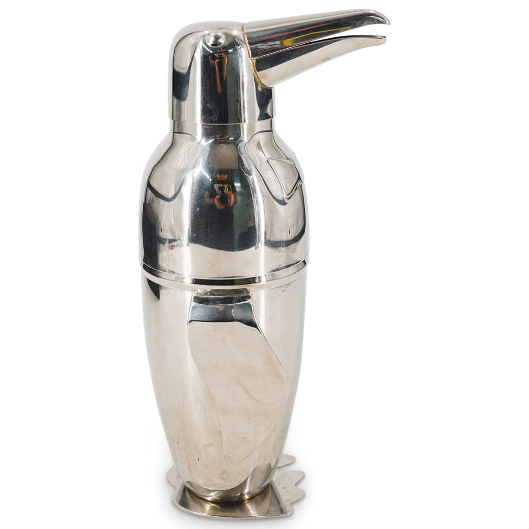 Penguin Form Stainless Steel Cocktail Martini Shaker: DESCRIPTION: Stainless steel cocktail/martini shaker crafted as a penguin donning a bowtie. Marked on underside. CIRCA: 20th to early 21st Century ORIGIN: China DIMENSIONS: H: 11" W: 5" L: 4.25" CONDI