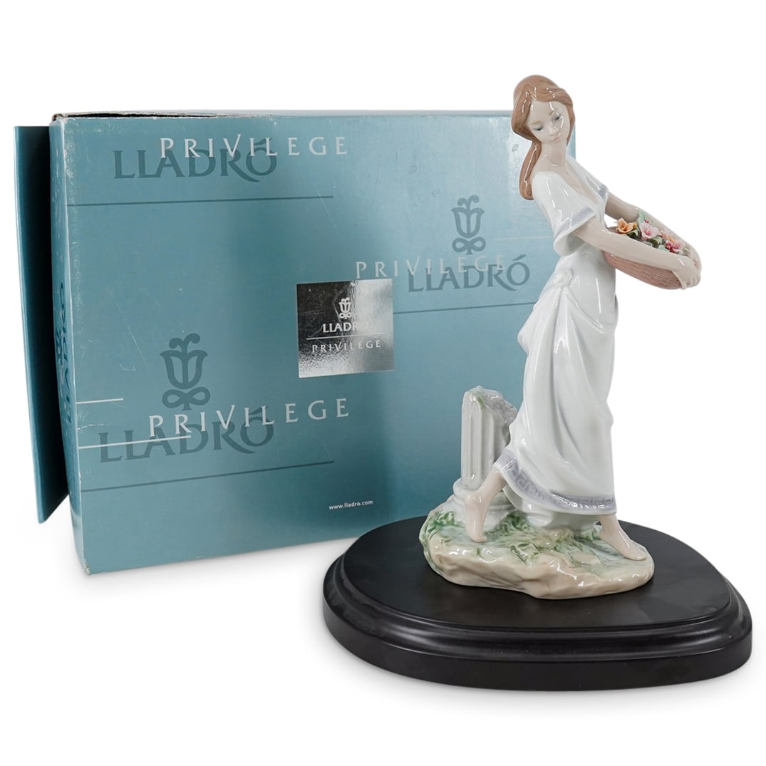 Lladro "Garden of Athens" Porcelain Figurine: DESCRIPTION: Lladro porcelain figurine titled "Garden of Athens" (Jardines de Atenas).designed by sculptor Joan Coderch. The piece has a glazed finish. Model number: #7704. Year Issued: 2004. Year Ret