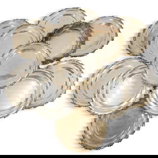 (12 Pc) Camusso Sterling Silver Luncheon Plates: DESCRIPTION: 12 sterling silver luncheon plates, mark of Camusso, each featuring scrolling foliage motif border with piercing. Each marked on underside. Total weight: 5138 g CIRCA: 20th century