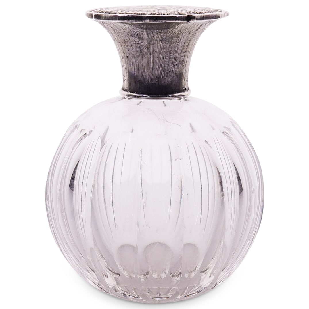 MCM Italian Pradella Ilario di Teodorico Glass And Sterling Silver Perfume Bottle: DESCRIPTION: Mid-century modern perfume bottle by Pradella Ilario di Teodorico featuring a rotund, cut glass body featuring a textured sterling silver collar and a sterling silver cap etched with flow