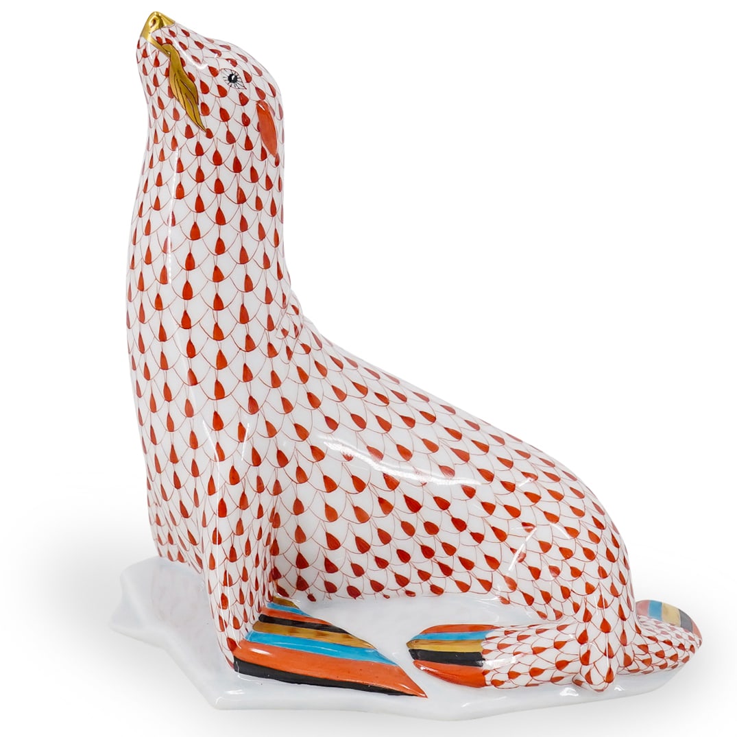 Herend Porcelain "Sea Lion On Ice" Rust Fishnet Figurine: DESCRIPTION: Herend porcelain figurine of a "Sea Lion On Ice" embellished in a rust hued fishnet pattern. Finished with gilded accents. Style:#5223. Marked along the underside with Herend stamps. CIRC