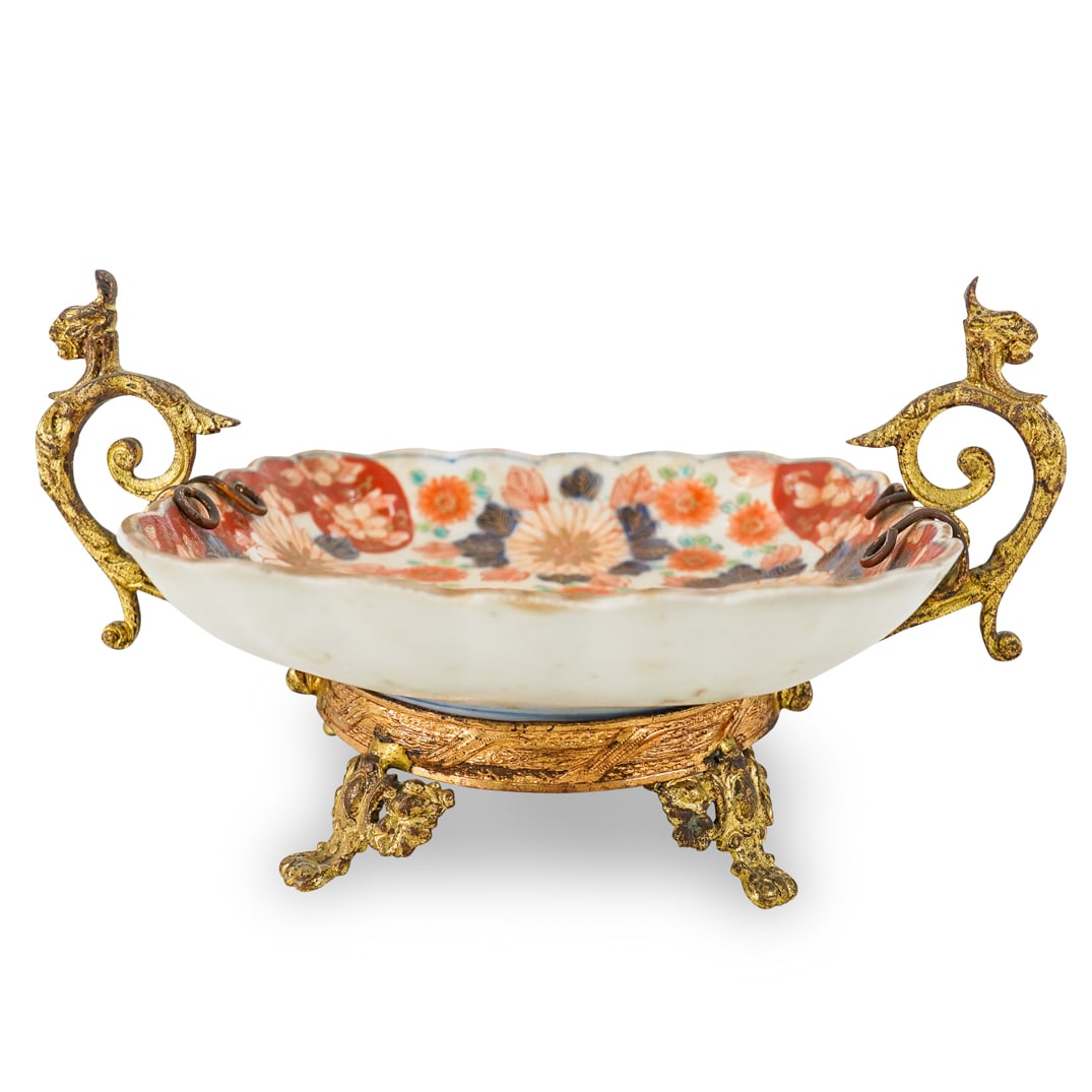 Japanese Koransha Arita Imari Porcelain Footed Bowl: DESCRIPTION: Japanese squared porcelain bowl with scalloped edges, supported on a gilt metal footed frame.. From the Meiji Period (1868-1912). Fukagawa Koransha, Arita, Japan. Maker's mark on base. CI