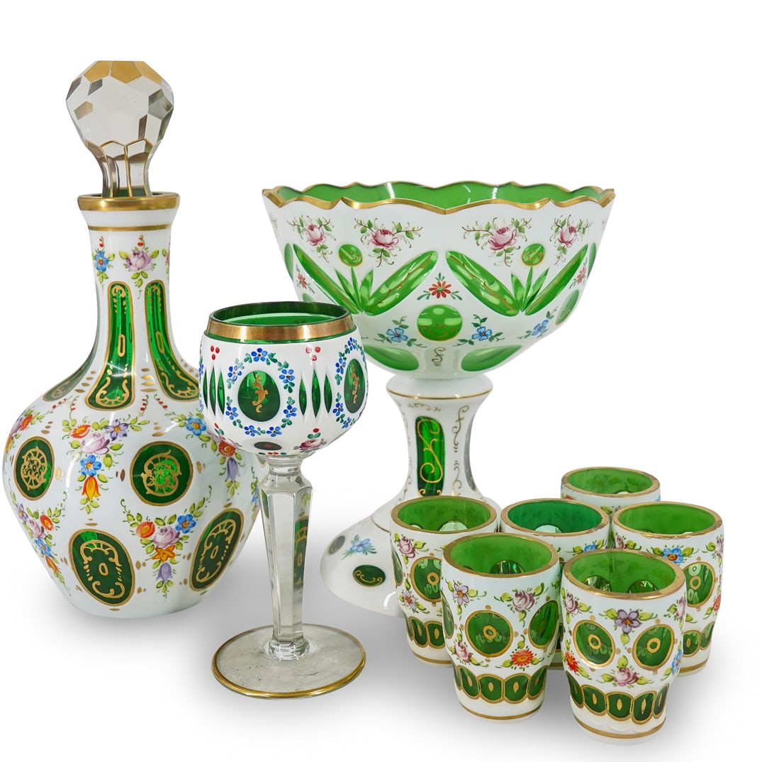 (9 Pc) Vintage Czech Bohemian White Cut To Green Glass Grouping: DESCRIPTION: (9 Pc) Vintage Czech Bohemian white to green cut glass grouping sete. Includes: one (1) decanter, six (6) goblets, one (1) compote bowl, and one (1) wine glass. CIRCA: 20th Century ORIGIN