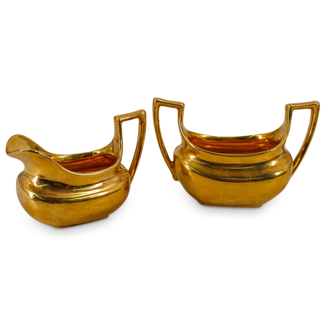 (2 Pc) Vintage Gilt Porcelain Creamer & Sugar Bowl: DESCRIPTION: (2 Pc) Vintage Gilt Porcelain Creamer & Sugar Bowl. Unmarked. Includes: one (1) small gilt porcelain sugar bowl, and one (1) small gilt porcelain creamer. CIRCA: 20th Century ORIGIN: Euro
