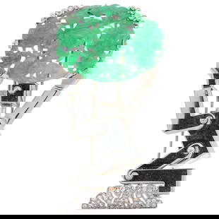 Unique 14k Gold, Jadeite and Diamond Robot Brooch: DESCRIPTION: A unique 14k white gold brooch featuring a stylized robot form supporting a fitted carved jadeite plaque displaying lotus flower and pomegranate motifs. Completed with diamonds along the