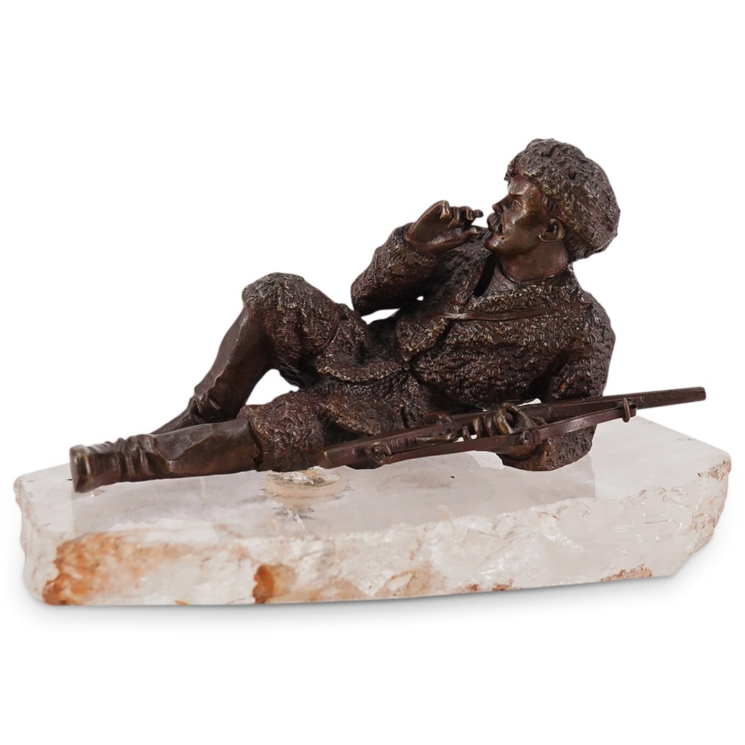 Antique Russian Bronze & Rock Crystal Smoking Cossack: DESCRIPTION: Manner of Vasily Yakovlevich Grachev Russian bronze smoking cossack figure posed reclined on a natural rock crystal slab, bronze cast with intricate textured coat, and creased boot detail